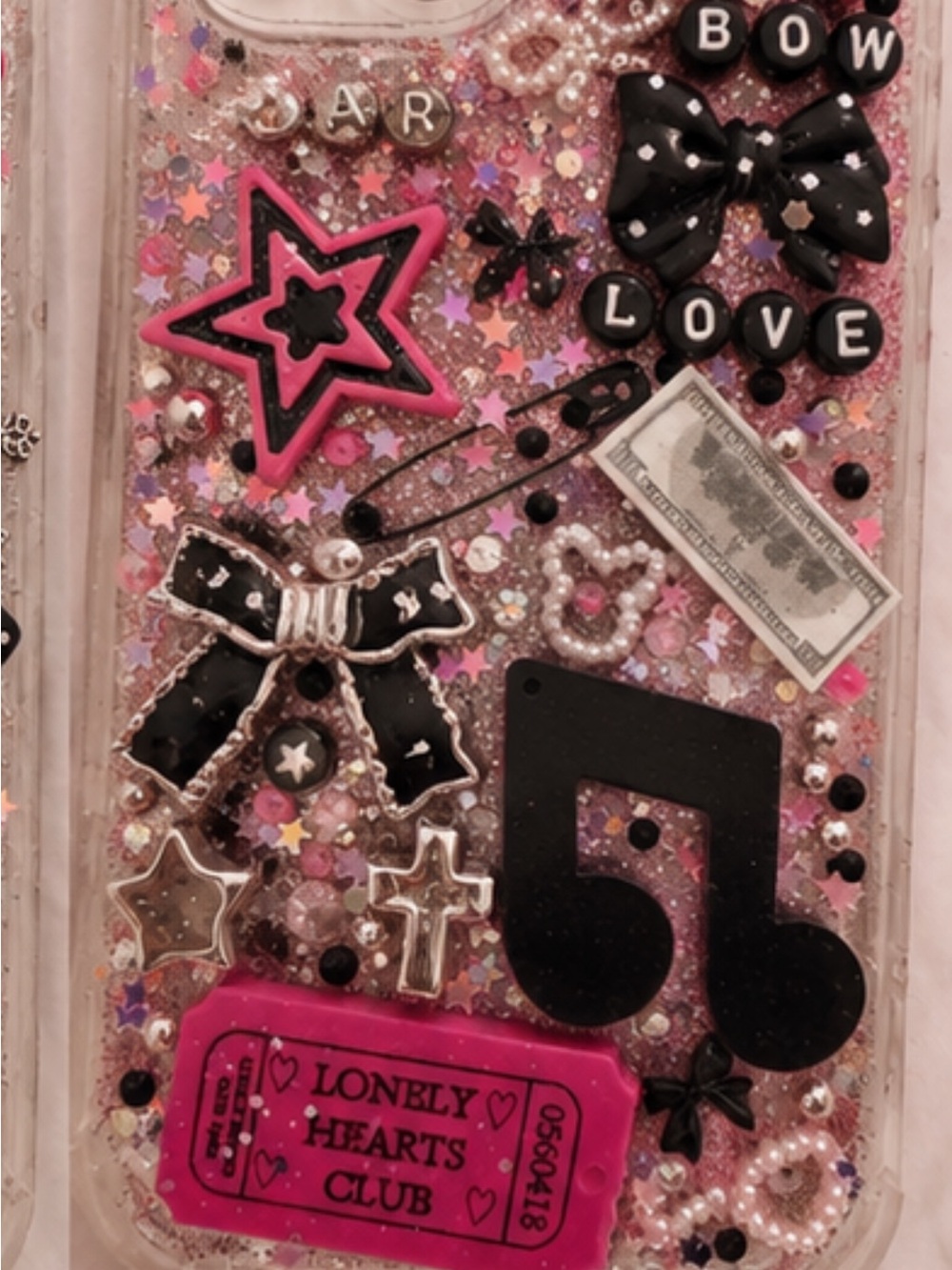 HandmadeDecorative Pink Glitter Phone Case with Black Accents and Embellishments